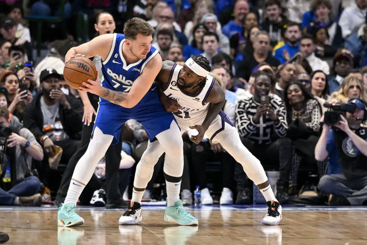 Luka Doncic (77) and Los Angeles Lakers guard Patrick Beverley (21)